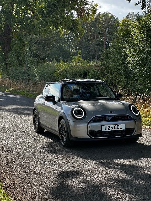 Mini Cooper S on a tree-lined country lane